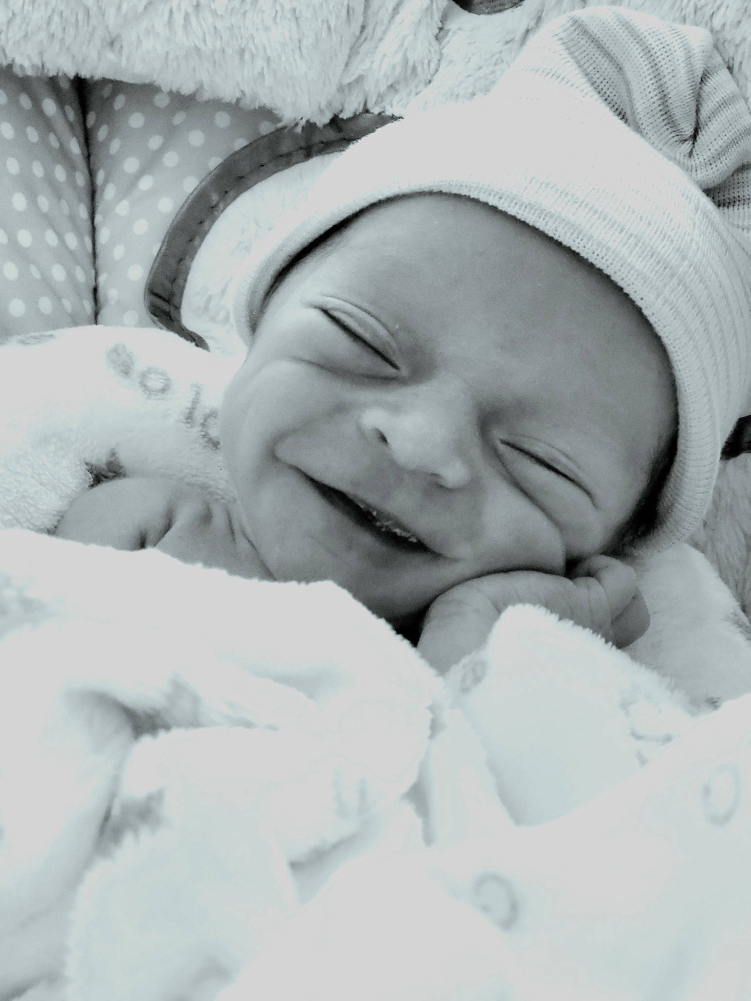 Thaddeus is registered to the contest to win money with this photo: baby, baby_sleeping, bedtime, cheek, child, comfort, event, eye, face, happy, headgear, linens, love, monochrome, monochrome_photography, nap, person, skin, smile, toddler