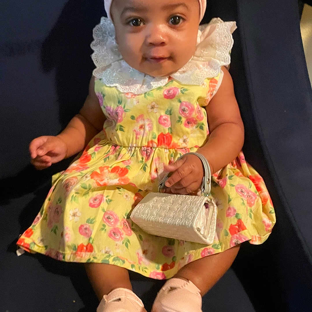 Bradleigh Blakley joined the competition — help win amazing prizes! accessories, baby, bag, bonnet, cap, clothing, costume, dress, face, footwear, handbag, hat, head, person, photography, portrait, purse, sandal, shoe, sitting