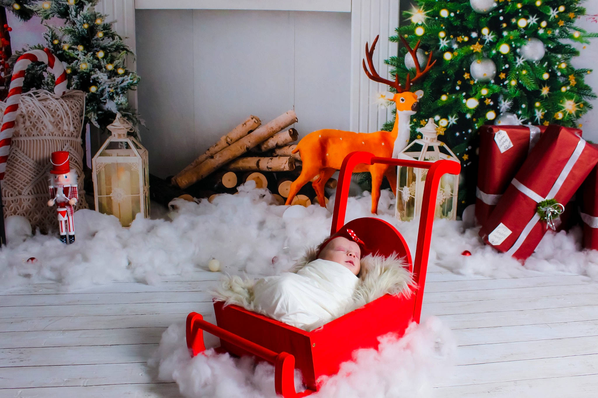 Ophelianna is registered to the contest to win money with this photo: christmas_decoration, christmas_ornament, christmas_tree, comfort, green, holiday_ornament, interior_design, living_room, mammal, ornament, person, photograph, property, red, snapshot, snow, toy, white, winter, wood