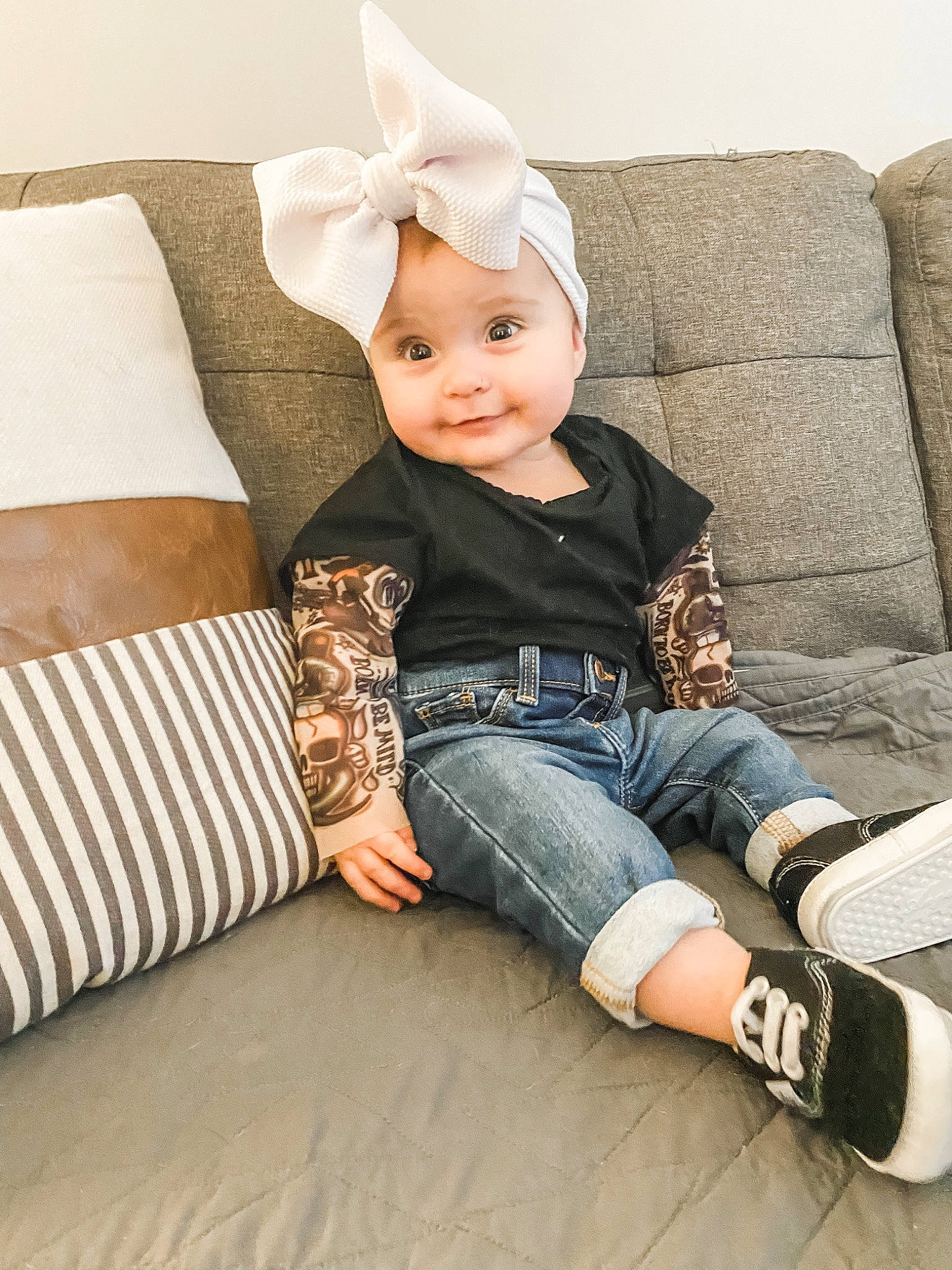 Lorelai joined the competition — help win amazing prizes! baby, baby_toddler_clothing, child, comfort, flash_photography, happy, hat, headwear, human_leg, jeans, knee, mammal, pattern, person, sitting, skin, sleeve, smile, t_shirt, textile