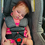 Phoenix joined the competition — help win amazing prizes! baby, sleeping, car_seat, gray, pink_clothing, pacifier, child, infant, safety_harness, cute, face, sticker, relaxation, indoors, transportation, seatbelt, toddler, resting, small_child, wearing_clothes