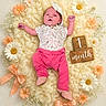 baby, bows, celebration, child, closeup, cute, daisies, decorative, flowers, fluffy_blanket, headband, infant, lying_down, milestone, month_marker, newborn, pink_pants, portrait, soft_texture, wooden_blocks