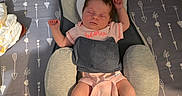 Phoenix is registered to the contest to win money with this photo: arrows, baby, bed, blanket, clothing, crib, crochet, cushion, face, furniture, hair, hearts, indoors, infant, pattern, peaceful, person, pink_onesie, rest, sleeping