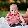 baby, child, infant, red_checkered_shirt, jeans, white_blanket, outdoor, grass, bokeh, tattoo, bracelet, arm, person, portrait, cute, smiling, sitting, nature, sunlight, support