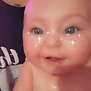 Aspen is registered to the contest to win money with this photo: baby, child, face, smile, sparkles, freckles, close_up, skin, hand, person, cute, happy, indoor, portrait, filter, young, infant, expression, cheeks, blue_eyes