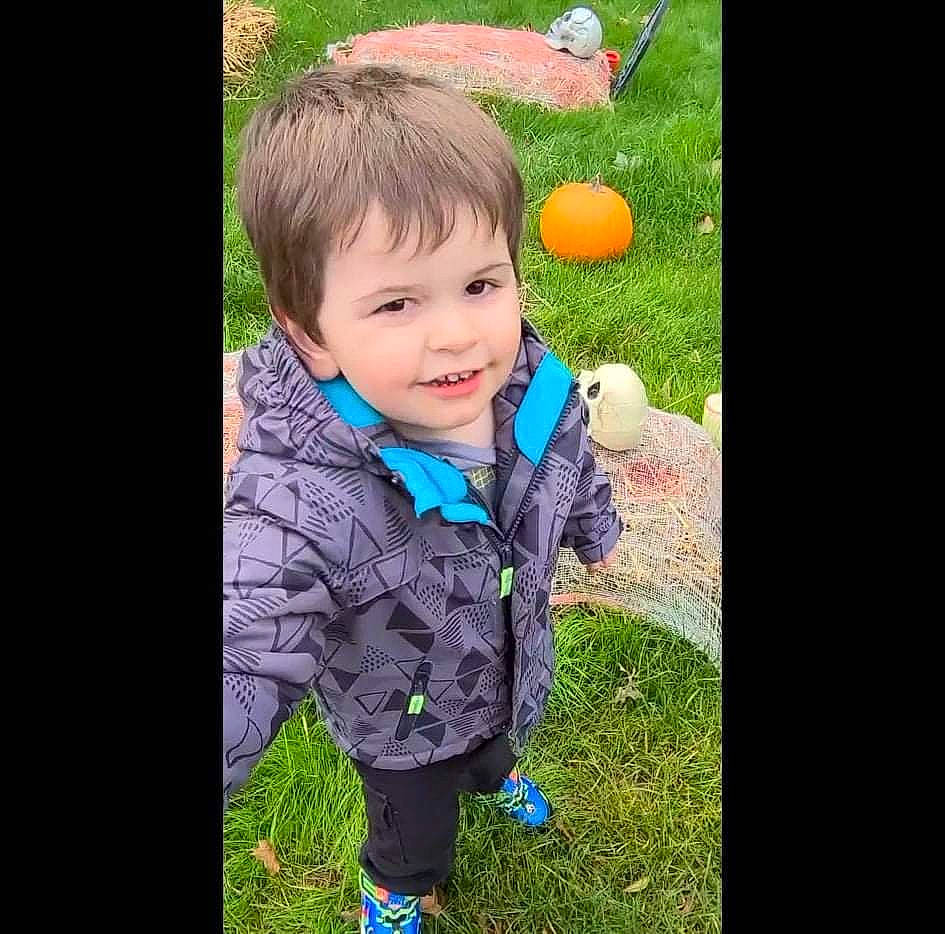 Zayden joined the competition — help win amazing prizes! baby, baby_toddler_clothing, ball, electric_blue, eye, fun, grass, happy, jacket, joy, lawn, leisure, outerwear, pattern, people_in_nature, person, plant, recreation, sitting, sleeve