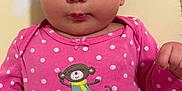 Monica participe au concours pour gagner de l'argent avec cette photo : adorable, baby, baby_girl, child, cute, expression, eyes, face, hand, head, indoors, infant, laying_down, monkey_design, onesie, pink_clothing, polka_dot, portrait, skin, young_child