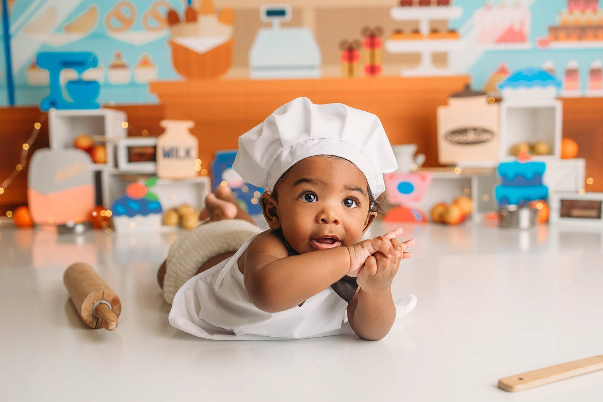 Kellan joined the competition — help win amazing prizes! baby, chair, child, comfort, desk, finger, flooring, fun, happy, hat, headgear, headwear, leisure, person, plastic, product, room, service, sitting, surprise