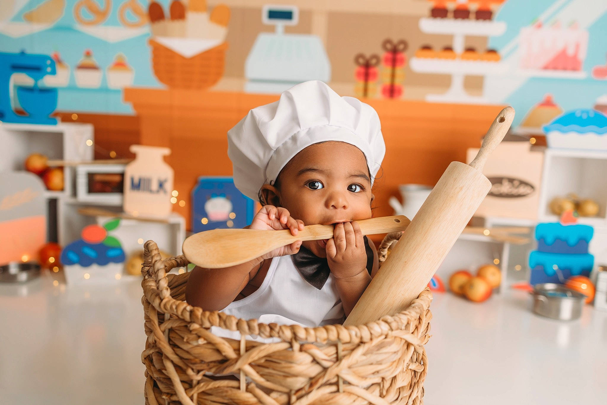 Kellan is registered to the contest to win money with this photo: animation, baby, baking, basket, chef, child, cook, cooking, fun, games, happy, hat, headgear, headwear, leisure, person, play, room, service, sitting