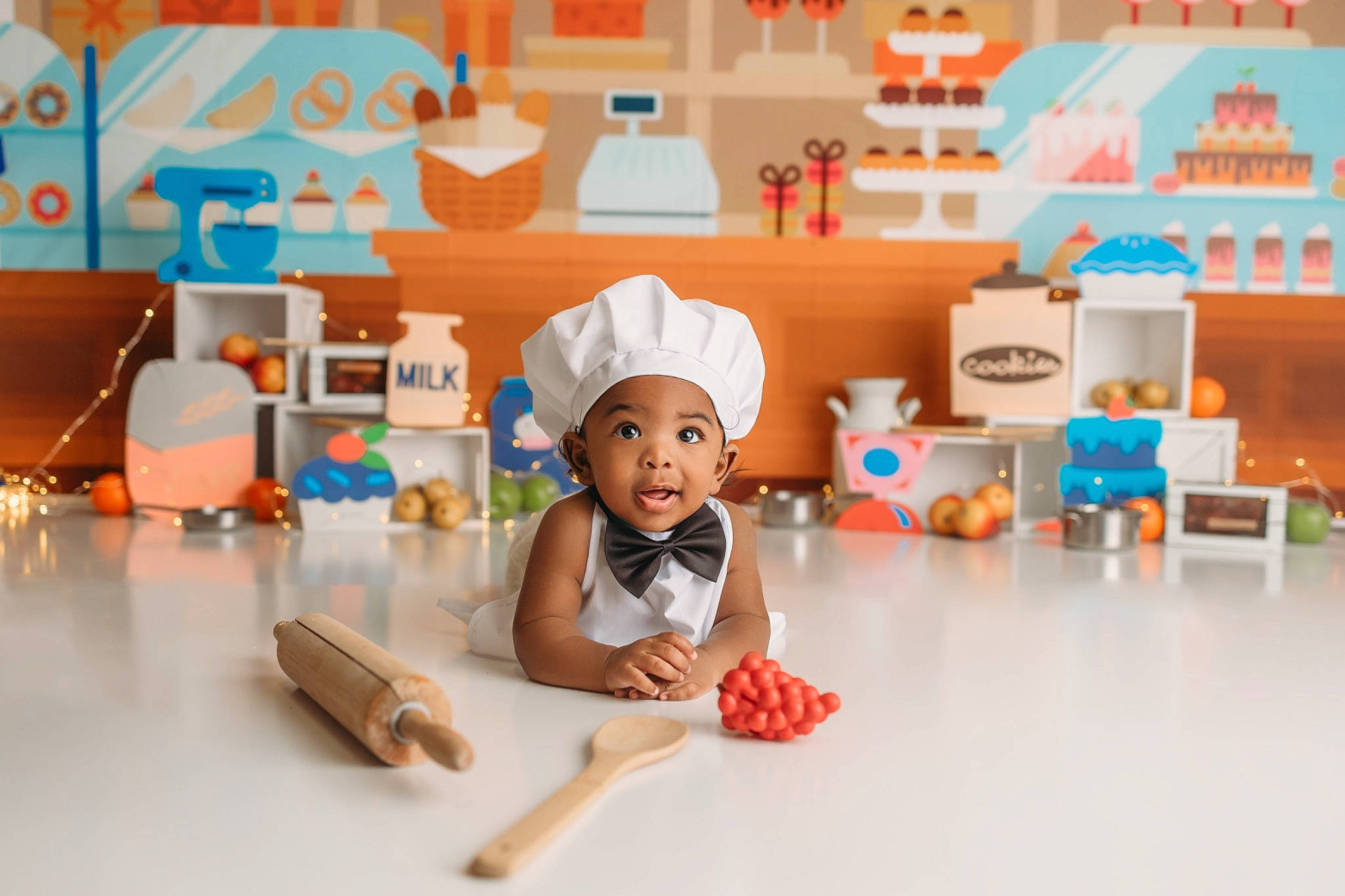 Kellan is registered to the contest to win money with this photo: animation, baby, child, floor, flooring, fun, happy, hat, headwear, knee, leisure, orange, person, plastic, play, product, room, sitting, t_shirt, toddler