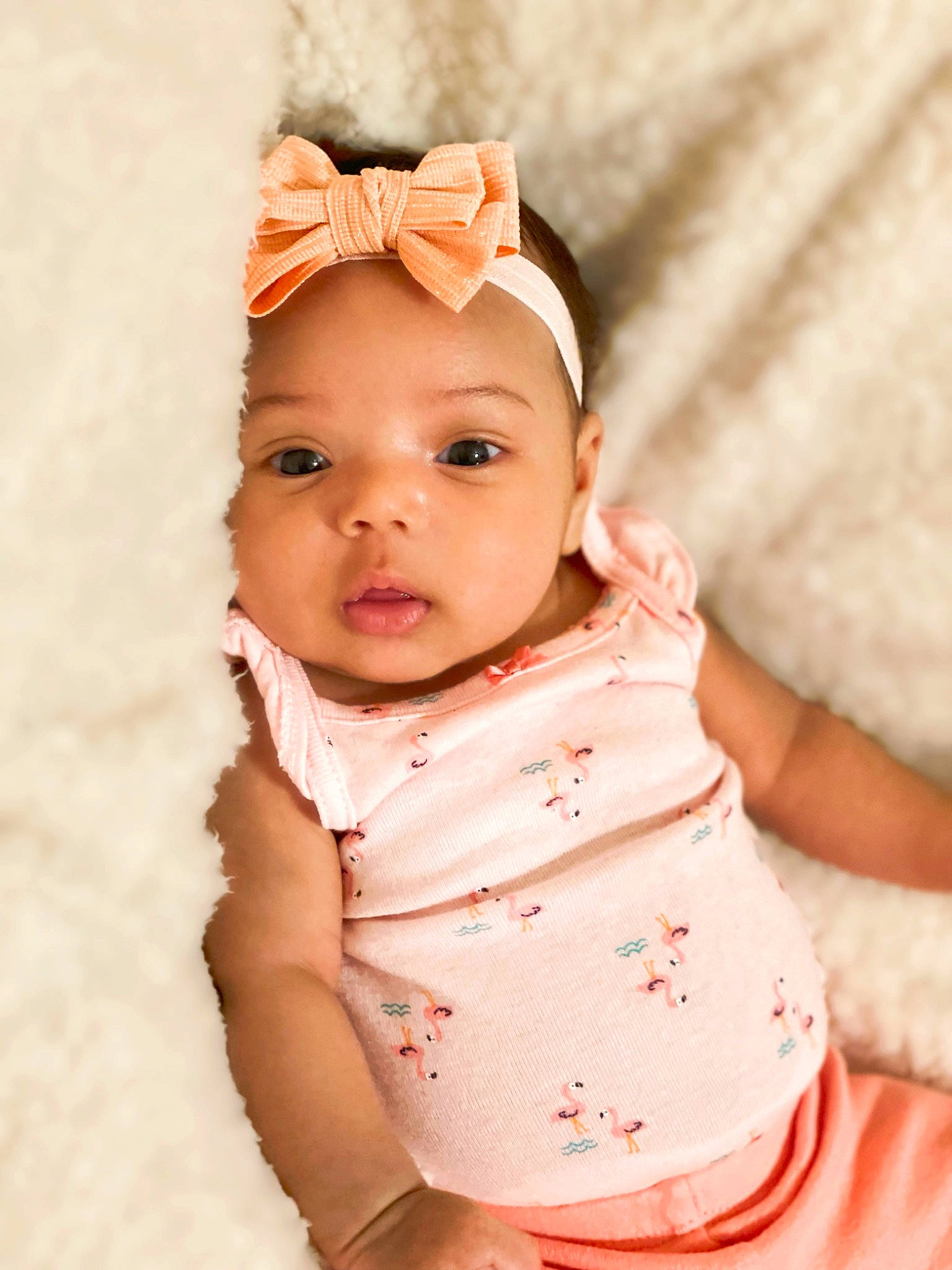 Chanel is registered to the contest to win money with this photo: baby, baby_toddler_clothing, cap, cheek, child, collar, dress, eye, eyelash, fashion_accessory, happy, headwear, human_body, iris, lip, nose, peach, person, pink, skin