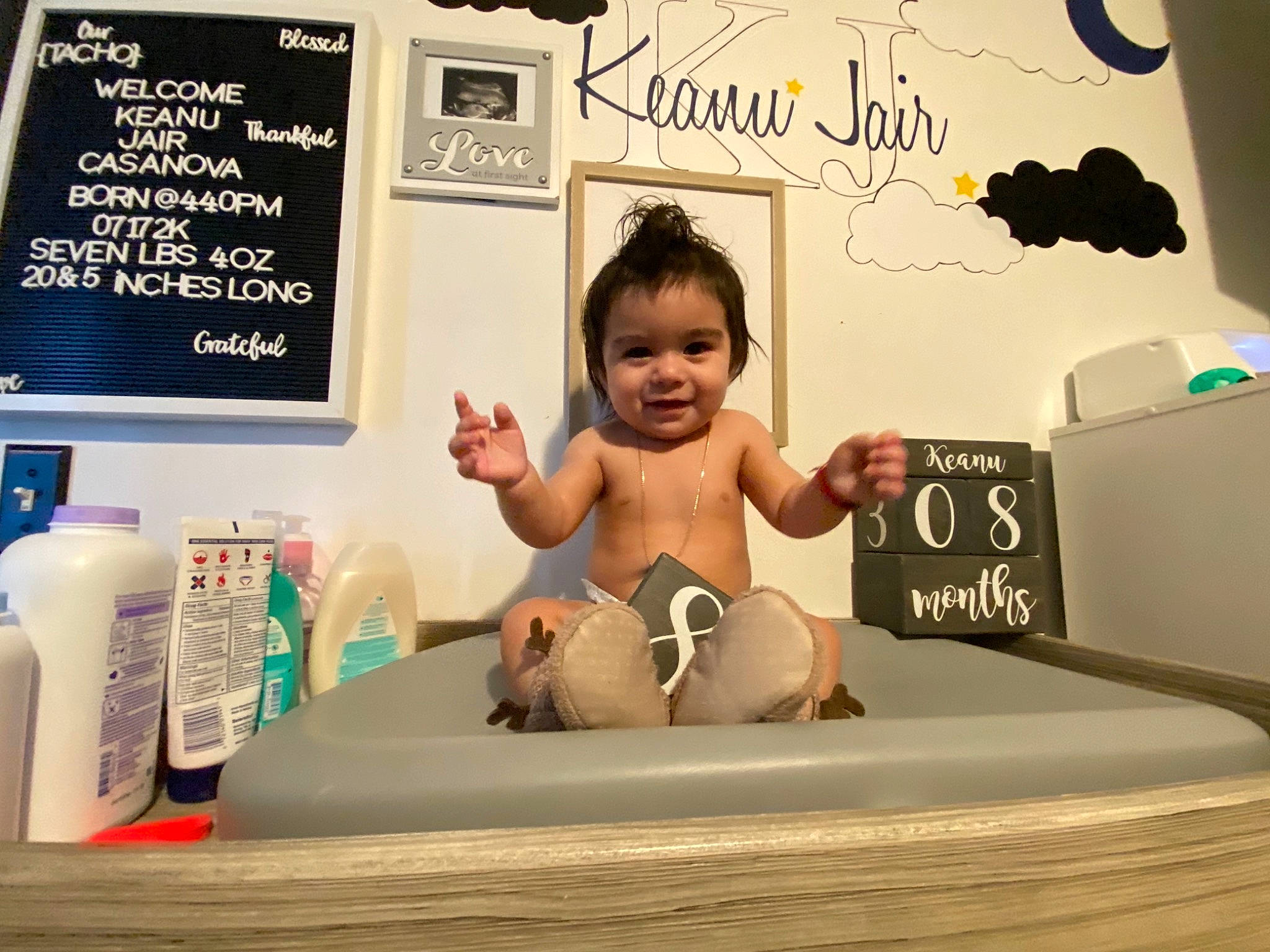 Keanu joined the competition — help win amazing prizes! advertising, art, baby, barefoot, child, comfort, flooring, font, hairstyle, happy, human_leg, illustration, joy, knee, person, picture_frame, room, shorts, sitting, smile