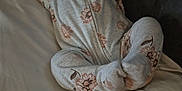 Maddie joined the competition — help win amazing prizes! baby, sleeping, pajamas, floral_pattern, pillow, blanket, couch, infant, cozy, indoors, resting, child, soft_lighting, peaceful, hands_up, footed_pajamas, person, relaxation, home, cute