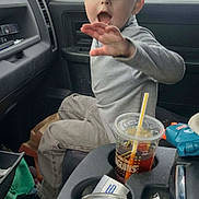 Karson joined the competition — help win amazing prizes! child, boy, car, interior, seat, window, drink, cup, toy, clothing, expression, hand, snow, background, dashboard, seatbelt, casual, young, portrait, vehicle