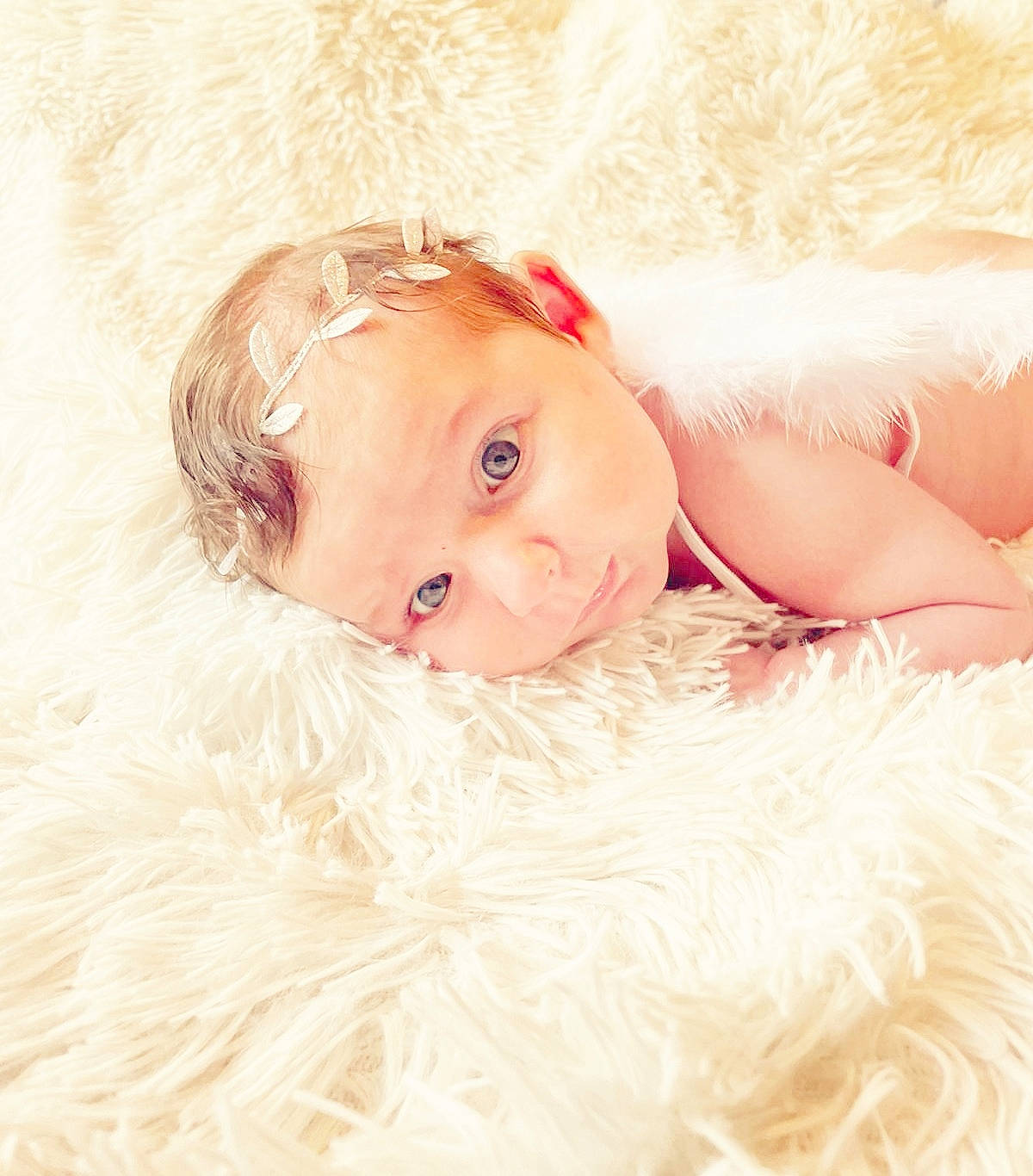 Maddy participe au concours pour gagner de l'argent avec cette photo : baby, child, close_up, eye, eyebrow, face, fawn, flash_photography, fur, hair_accessory, happy, head, headgear, headpiece, iris, lip, person, skin, textile, toddler