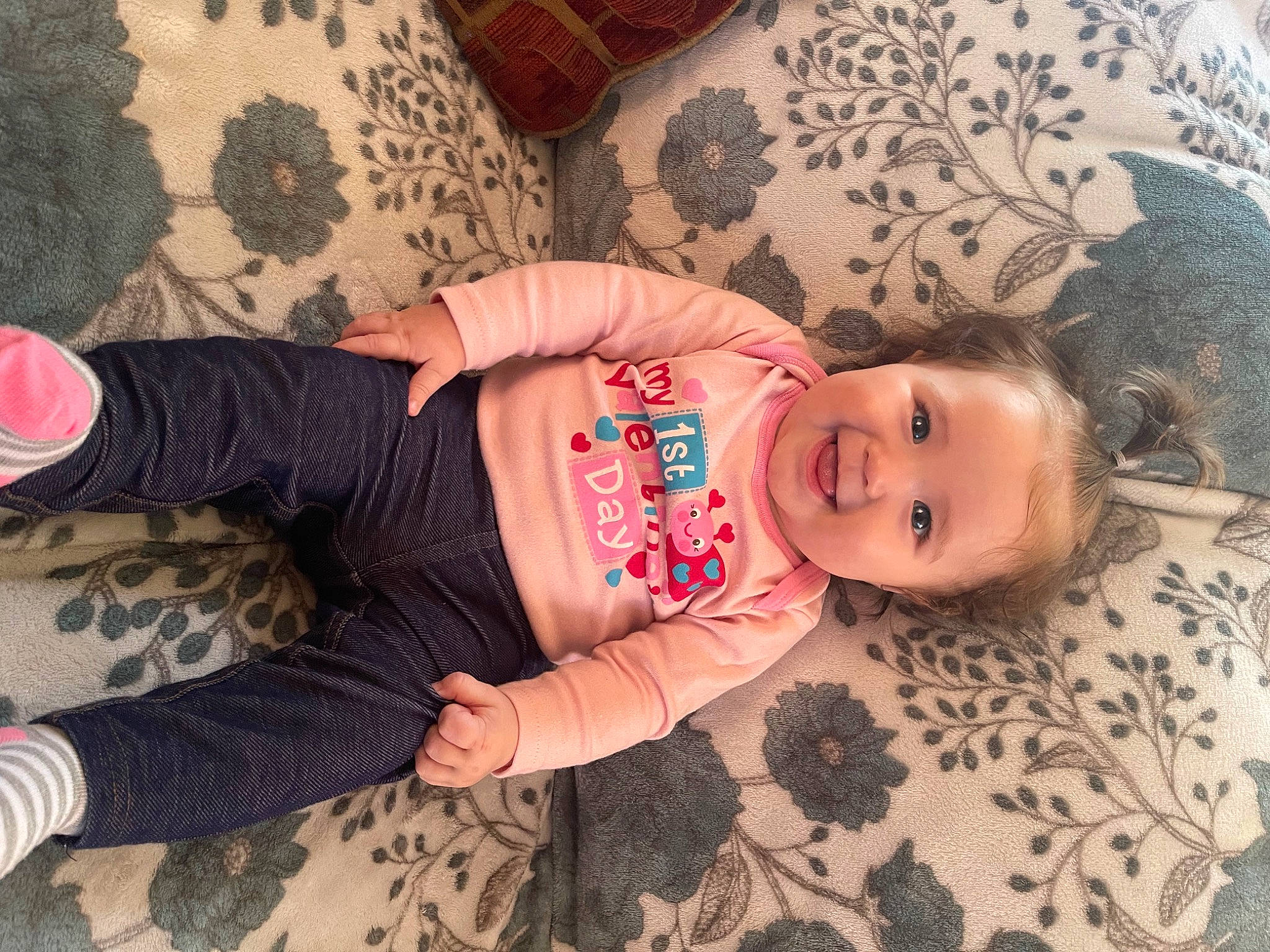 Letty is registered to the contest to win money with this photo: arm, baby_toddler_clothing, cheek, comfort, eye, facial_expression, fawn, finger, floor, flooring, hand, headgear, joint, joy, mouth, nose, person, pink, skin, sleeve