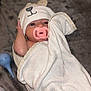 Mercedes is registered to the contest to win money with this photo: baby, infant, pacifier, towel, hooded_towel, bear_ears, blanket, skin, face, eyes, hand, lying_down, soft_texture, nursery, newborn, cute, comfort, indoor, child, wrapped