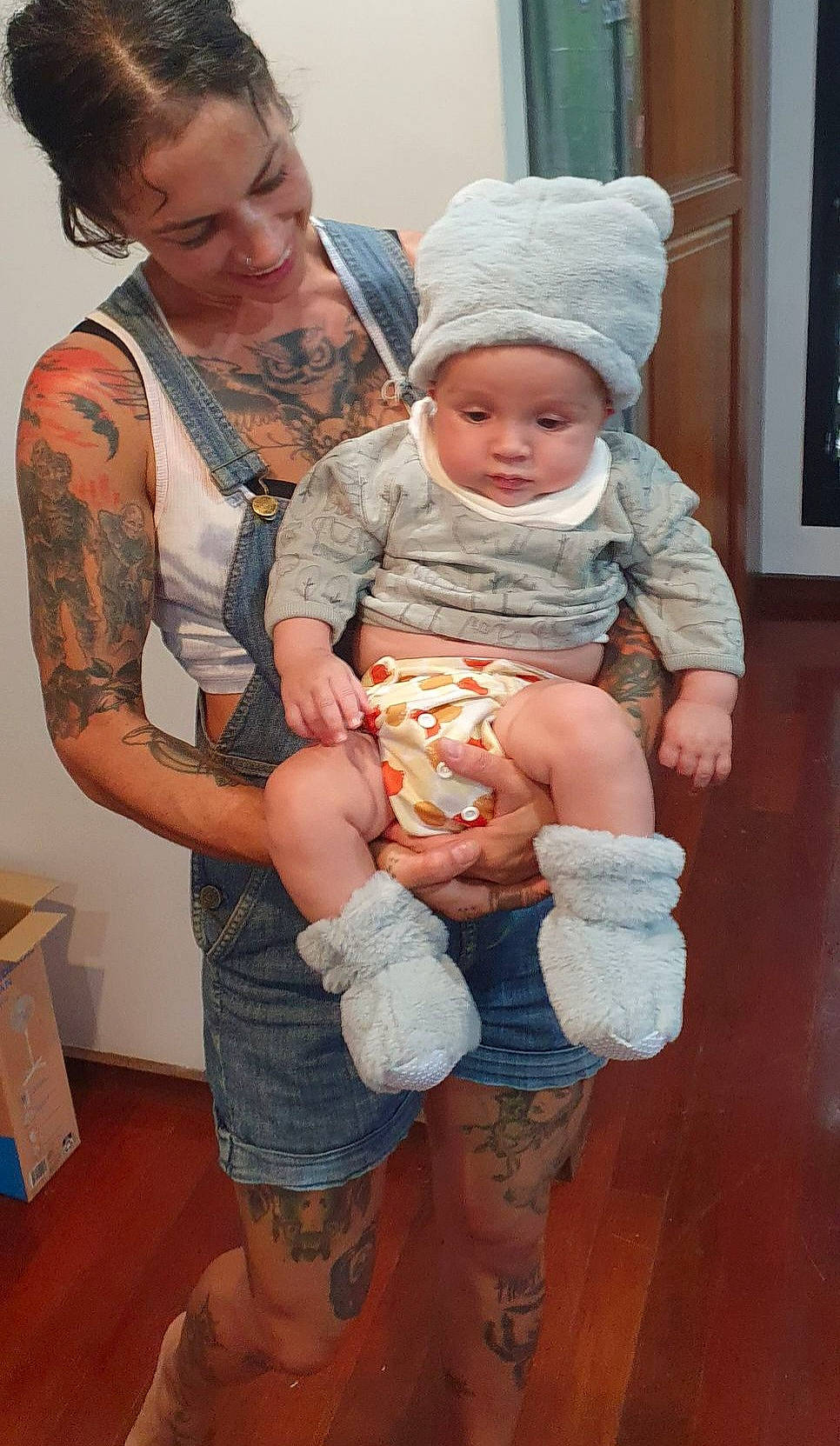 Sage is registered to the contest to win money with this photo: baby, baby_toddler_clothing, child, costume, event, face, fun, happy, headwear, human_leg, jewellery, lap, leg, organ, person, shorts, sitting, skin, smile, thigh