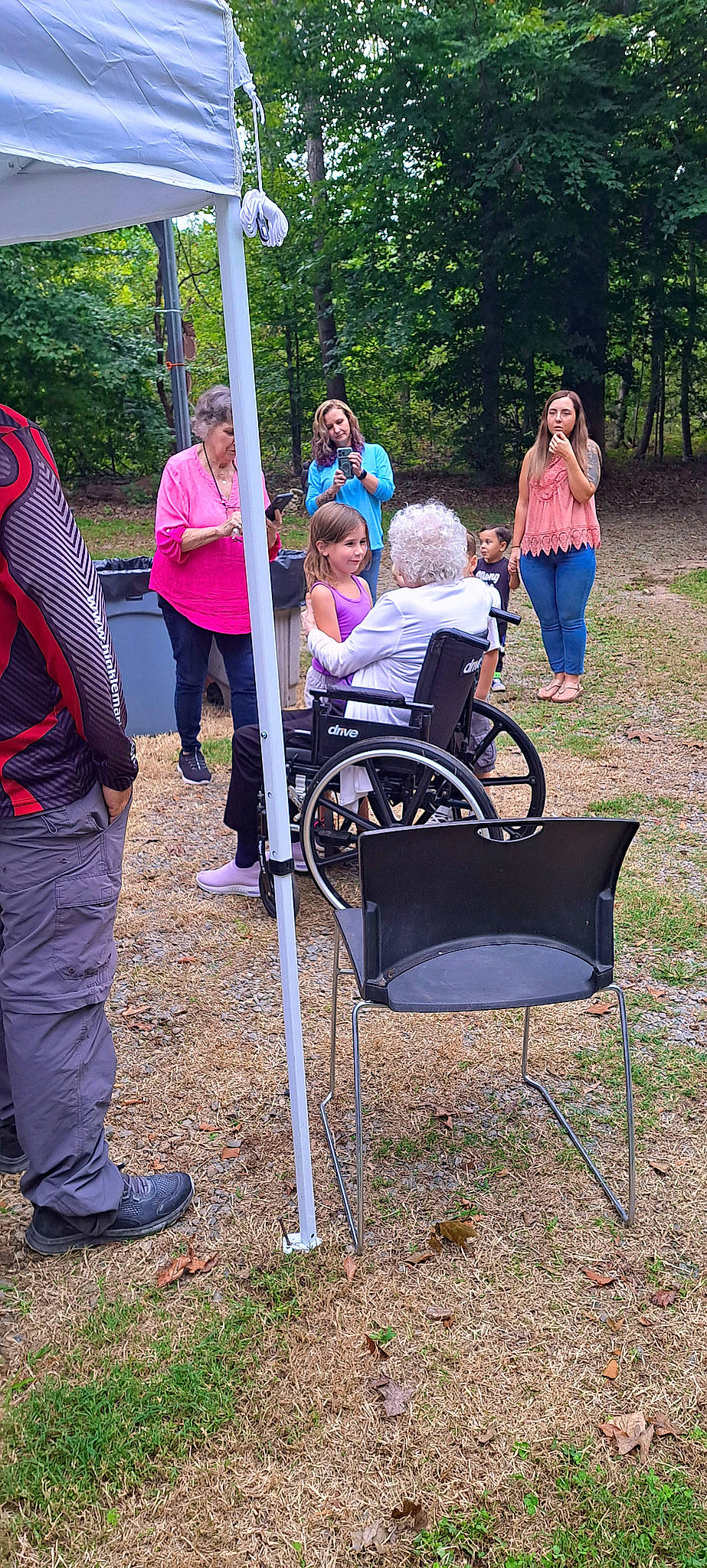 Ashlynn joined the competition — help win amazing prizes! baby_products, backpack, bag, chair, event, fun, grass, leisure, luggage_and_bags, outdoor_recreation, people_in_nature, person, plant, pole, recreation, shorts, sitting, soil, tree, wheel