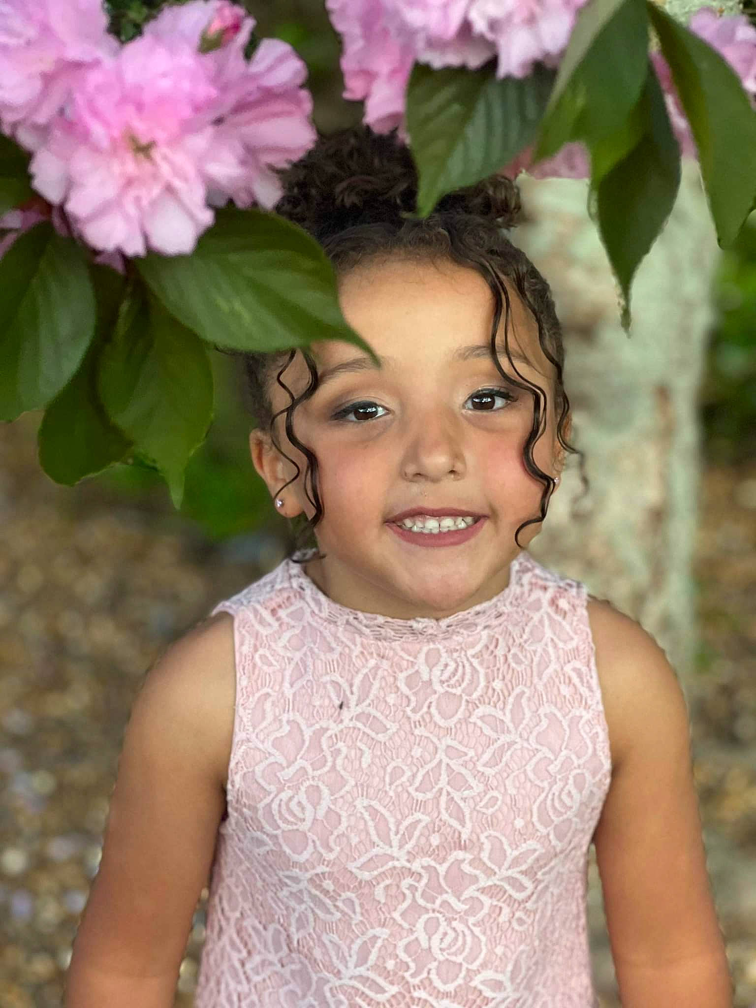 Abigail is registered to the contest to win money with this photo: chin, eye, eyebrow, eyelash, face, flash_photography, flower, grass, hair, hairstyle, happy, head, iris, joy, lip, person, petal, pink, plant, skin