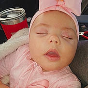 Raven is registered to the contest to win money with this photo: baby, sleeping, pink, headband, bow, pacifier, blanket, infant, closeup, face, child, cute, soft, relaxing, indoors, clothing, portrait, peaceful, tumbler, resting