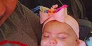 Raven joined the competition — help win amazing prizes! baby, child, adult, car, car_seat, headband, pink_clothing, sleeping, smiling, hand, window, seatbelt, interior, adult_face, person, portrait, cozy, daylight, curly_ribbon, closeup