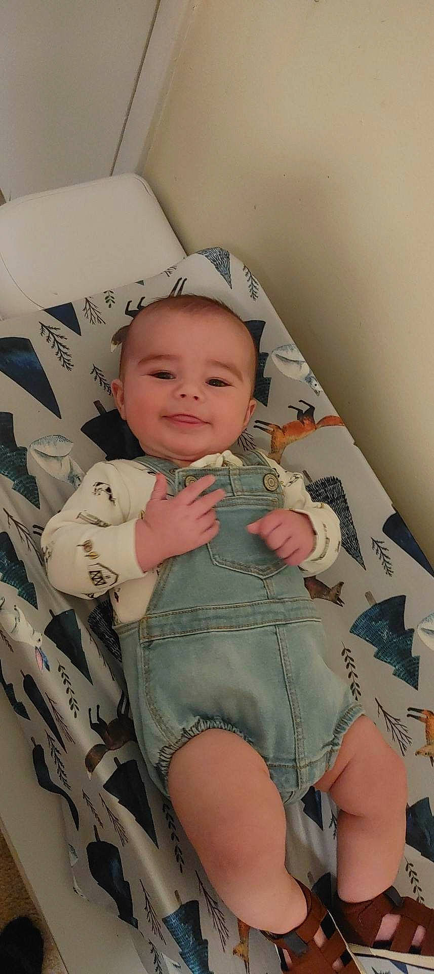 Kasey is registered to the contest to win money with this photo: baby, baby_safety, baby_toddler_clothing, cheek, chest, child, comfort, face, head, human_leg, joy, pattern, person, personal_protective_equipment, skin, sleeve, smile, swimwear, thigh, thumb