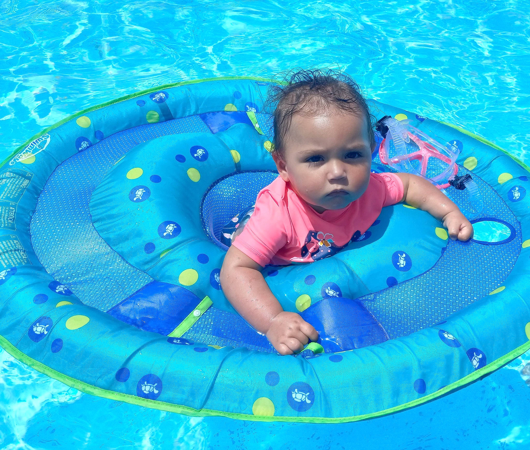 Lakelynn is registered to the contest to win money with this photo: aqua, azure, baby, baby_float, baby_toddler_clothing, bathing, blue, child, circle, electric_blue, fluid, fun, happy, inflatable, leisure, person, play, recreation, swimming_pool, toddler