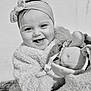 Mia participe au concours pour gagner de l'argent avec cette photo : baby, blanket, bow, child, closeup, clothing, cute, expression, face, happy, headband, infant, monochrome, outdoor, portrait, smiling, soft_texture, stuffed_animal, toddler, toy