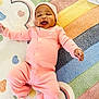 baby, babylaughing, blanket, bonnet, clothing, face, happy, hat, head, hosiery, laughing, newborn, pants, person, photography, portrait, quilt, smile, sock, yawning
