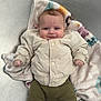 baby, infant, blanket, jacket, pants, fox_patch, metallic_tub, clothing, cute, lying_down, smile, face, hand, footwear, soft_texture, indoors, child, person, portrait, cozy