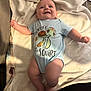 arms, baby, blanket, child, clothing, comfort, cozy, cute, expression, face, happy, indoors, infant, legs, lying_down, onesie, skin, smiling, soft_texture, turtle