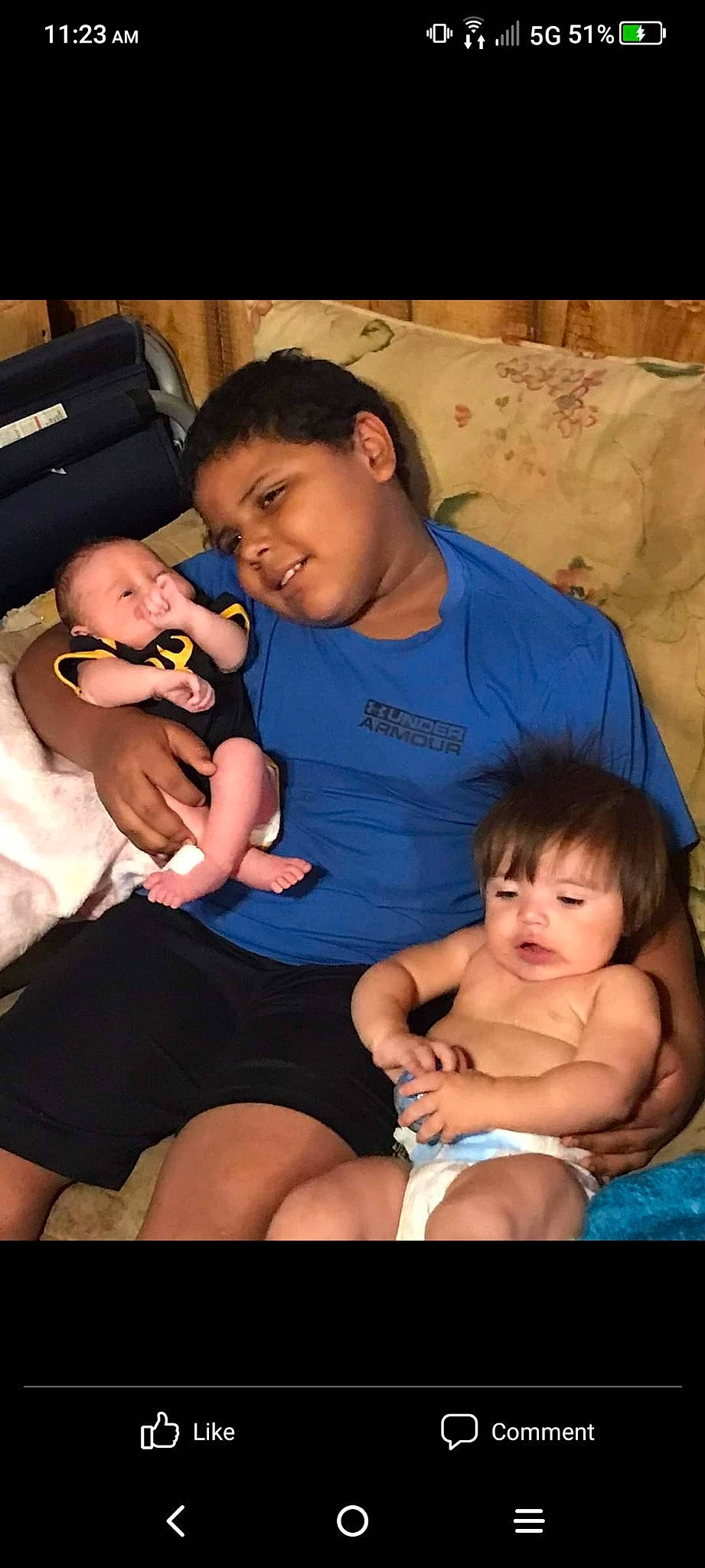 Aden is registered to the contest to win money with this photo: arm, child, comfort, finger, flash_photography, fun, hand, happy, human_body, interaction, lap, mouth, muscle, person, product, shorts, skin, smile, thigh, toddler