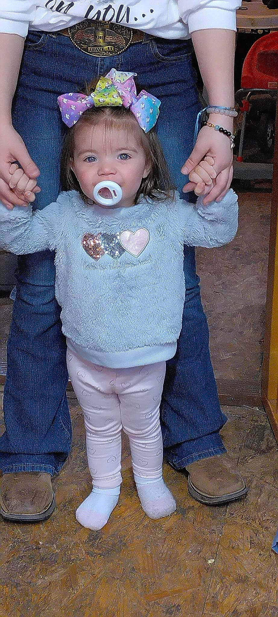 Ryleigh is registered to the contest to win money with this photo: baby, baby_toddler_clothing, blue, cheek, eye, face, finger, gesture, hair, hairstyle, hand, happy, head, human_body, iris, pattern, person, pink, skin, sleeve