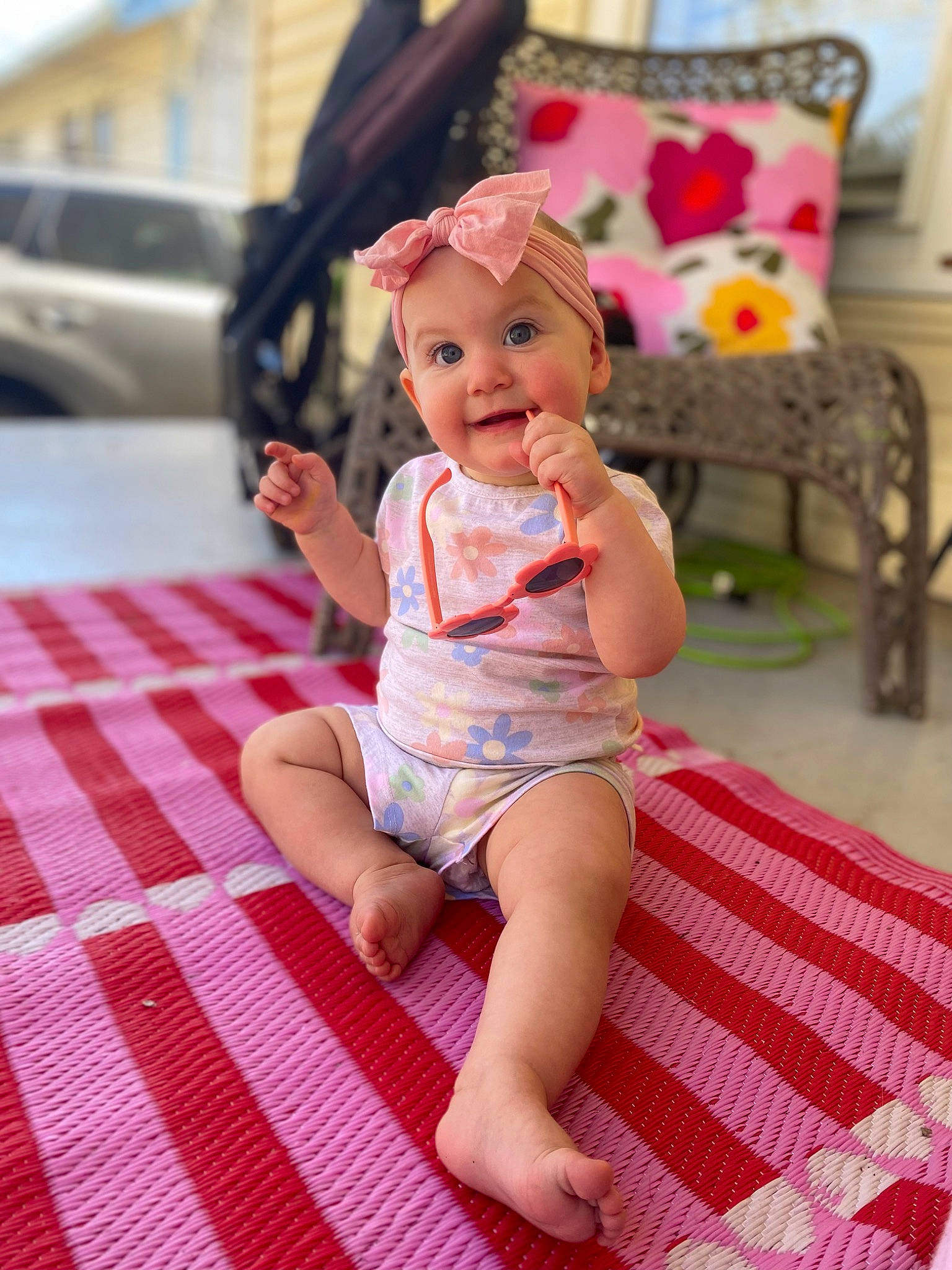 Eloise joined the competition — help win amazing prizes! baby_toddler_clothing, chair, eye, floor, flooring, foot, fun, happy, headwear, human_leg, knee, leg, leisure, pattern, person, pink, skin, smile, textile, thigh