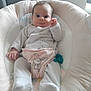 baby, infant, child, pajamas, bib, bunny, soft_toys, cushion, seat, indoor, cute, face, hands, feet, expression, comfort, cozy, smile, pacifier, home