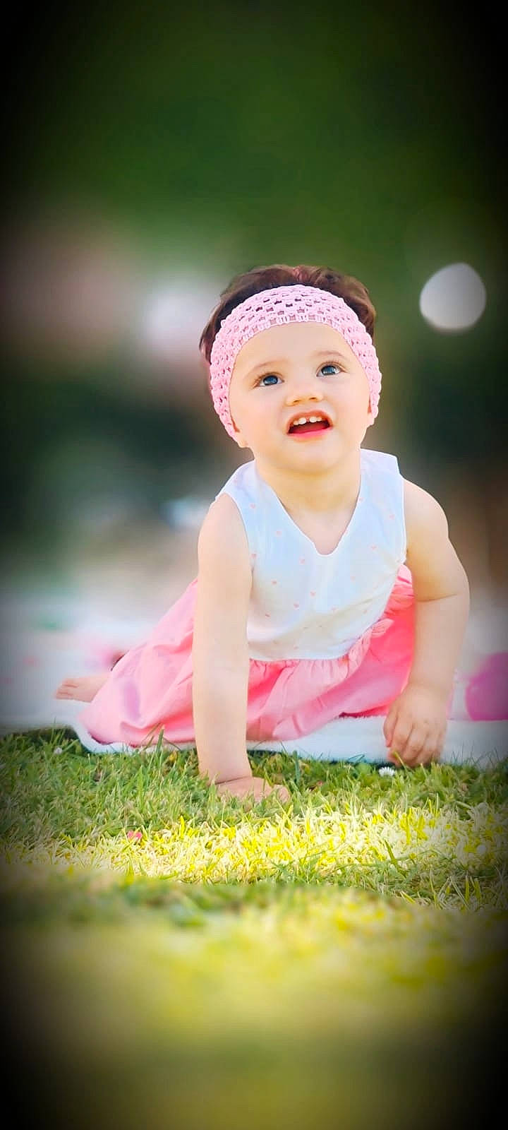 Lyana participe au concours pour gagner de l'argent avec cette photo : baby, baby_toddler_clothing, beauty, cap, dress, flash_photography, fun, grass, happy, headgear, headwear, leaf, leisure, people_in_nature, person, pink, plant, skin, smile, summer