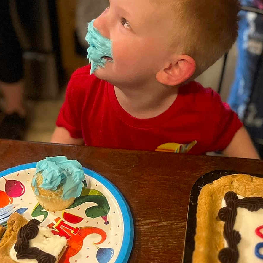 Cohen is registered to the contest to win money with this photo: birthdaycake, boy, cake, child, cream, dessert, diningtable, dish, face, food, head, icing, male, meal, people, person, photography, plate, portrait, sweets