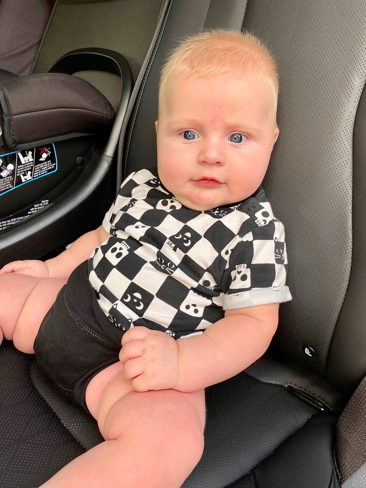 Dallas is registered to the contest to win money with this photo: automotive_design, baby, baby_toddler_clothing, blond, chair, comfort, dress, elbow, flash_photography, hand, human_leg, knee, person, product, sitting, skin, sleeve, thigh, tie, toddler