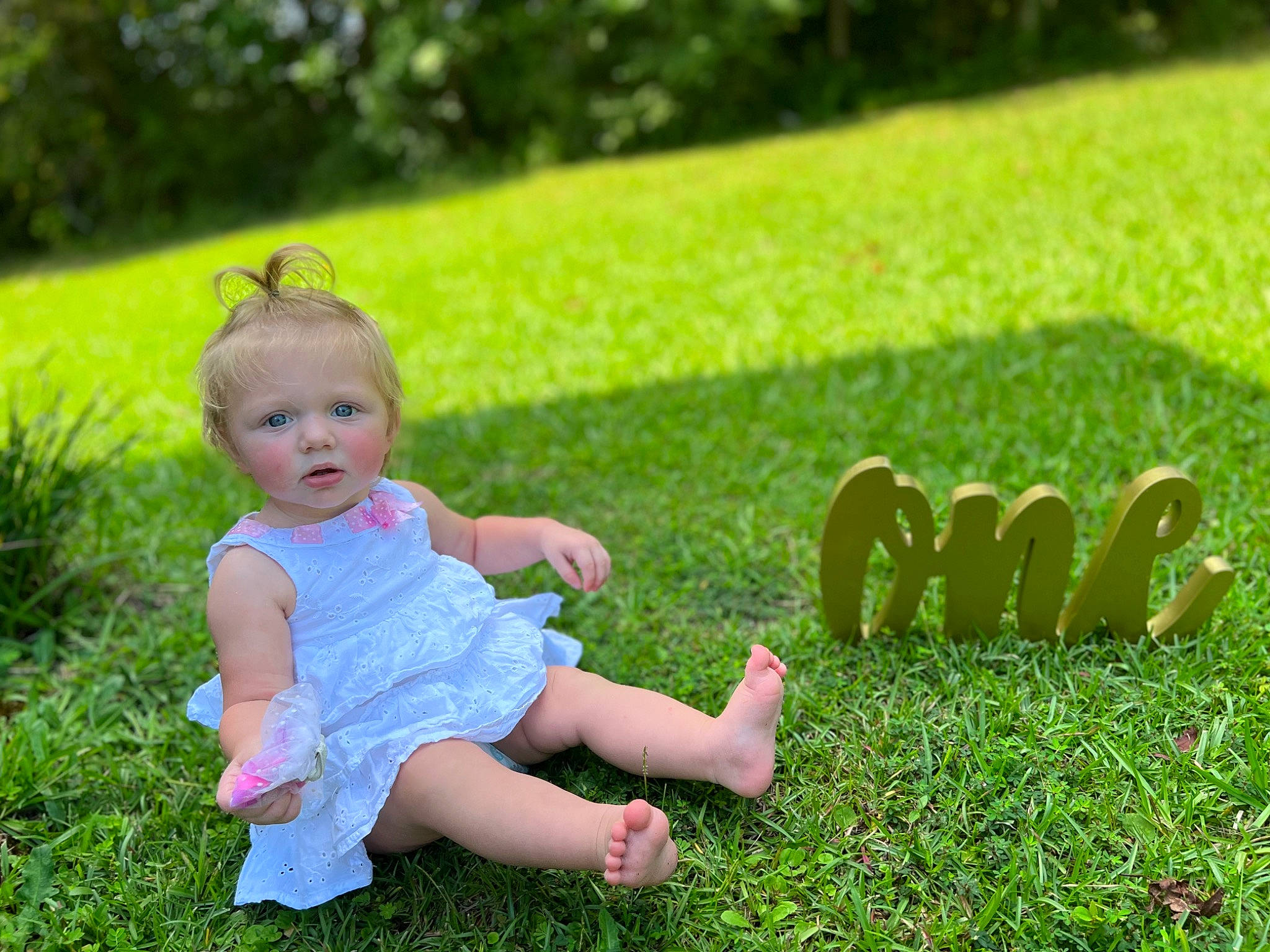 Ansley is registered to the contest to win money with this photo: baby, baby_toddler_clothing, child, finger, fun, gesture, grass, grass_family, grassland, green, groundcover, happy, lawn, leaf, leisure, meadow, people_in_nature, person, plant, summer