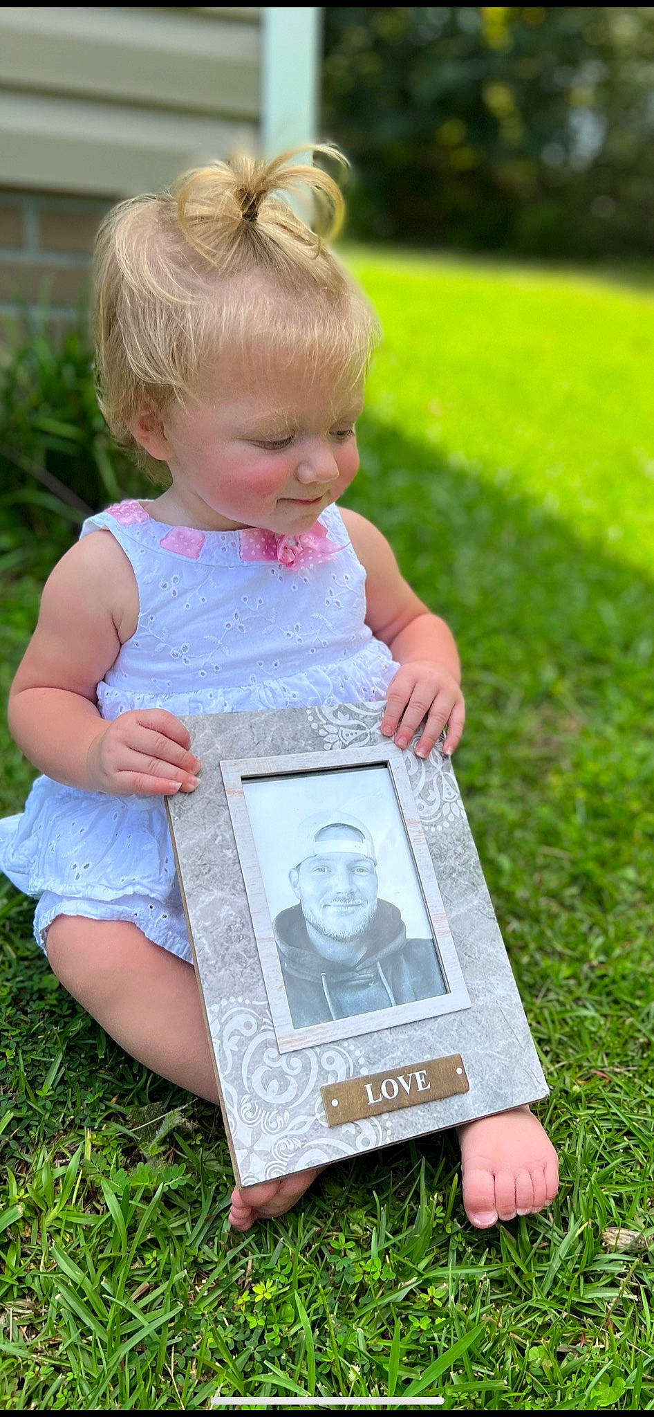 Ansley joined the competition — help win amazing prizes! baby, baby_toddler_clothing, dress, eye, face, facial_expression, grass, green, hand, happy, head, joy, leisure, people_in_nature, person, photograph, picture_frame, pink, plant, skin