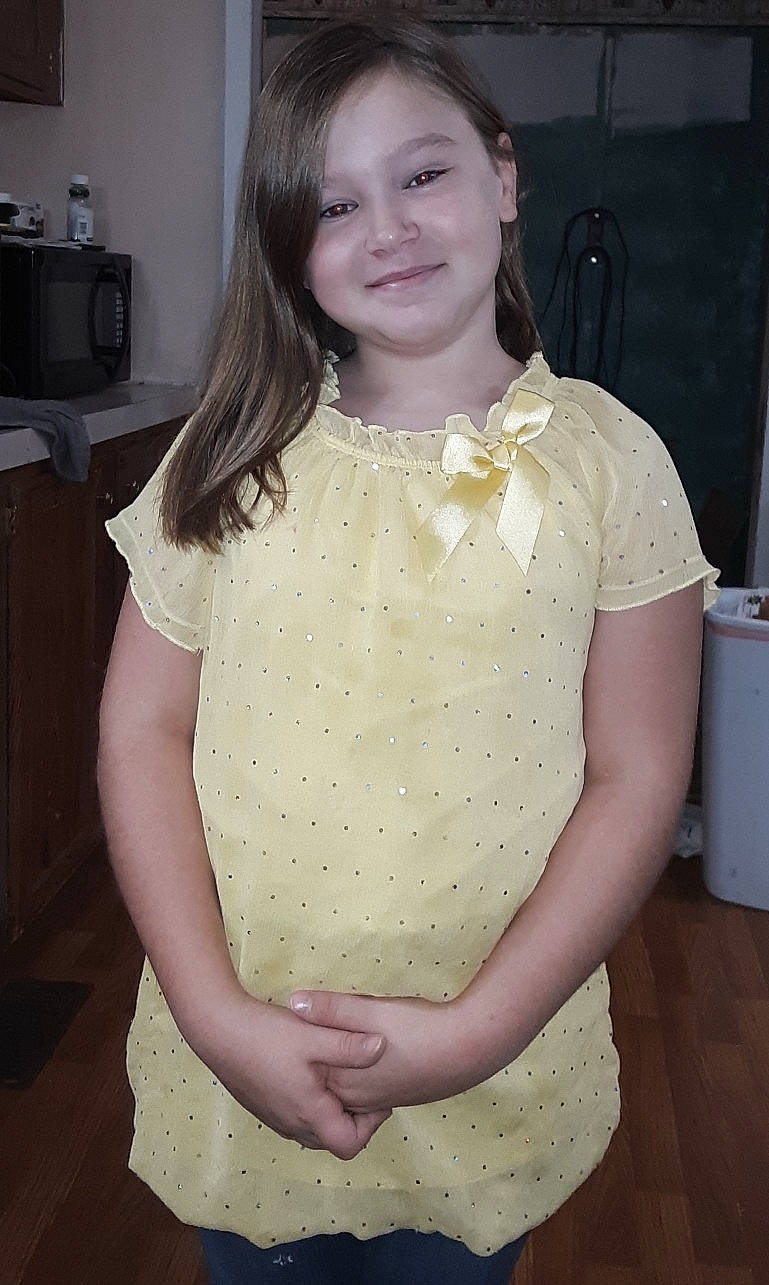 Cloey is registered to the contest to win money with this photo: abdomen, blouse, child, design, dress, hair, joy, long_hair, neck, pattern, person, textile, top, trunk