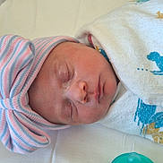 Macie joined the competition — help win amazing prizes! baby, blanket, bow, child, clothing, cozy, cute, duck_print, hat, headwear, indoors, infant, newborn, pacifier, peaceful, portrait, resting, sleeping, soft, wrapped