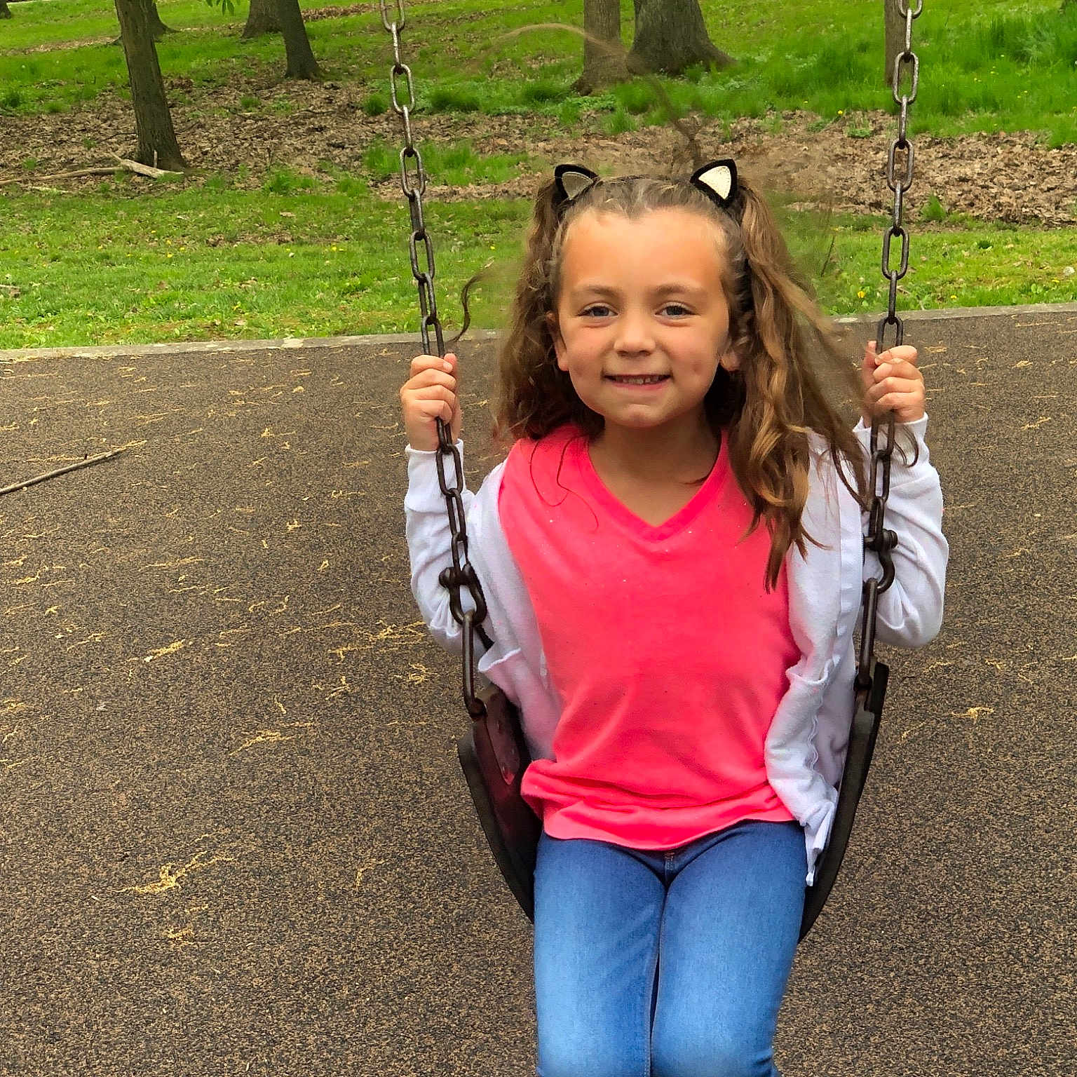 Paxtyn is registered to the contest to win money with this photo: child, fun, grass, happy, jeans, joy, leisure, outdoor_play_equipment, park, person, plant, play, playground, public_space, recreation, smile, style, swing, toddler, tree