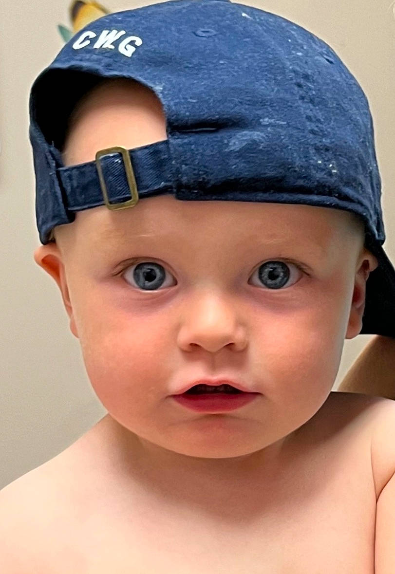 Cade is registered to the contest to win money with this photo: baby, baby_toddler_clothing, baseball_cap, blue, cap, child, chin, costume_hat, cricket_cap, electric_blue, eye, eyelash, fashion_accessory, happy, hat, headgear, headwear, no_expression, person, portrait_photography