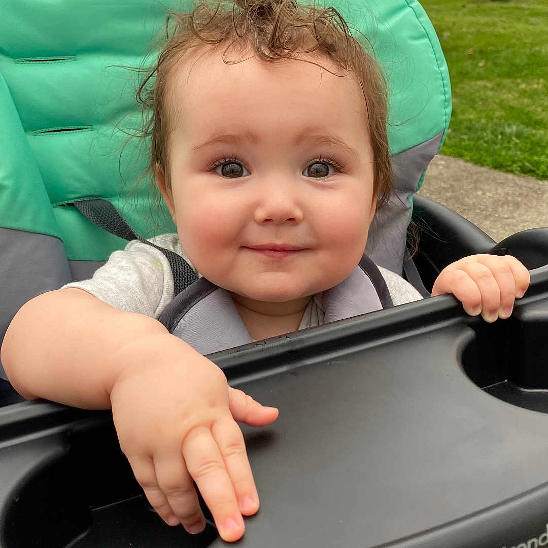 Wrenley joined the competition — help win amazing prizes! baby, bodypart, face, finger, grass, hand, happy, head, nature, outdoors, park, person, photography, plant, playarea, portrait, smile, stroller, transportation, vehicle