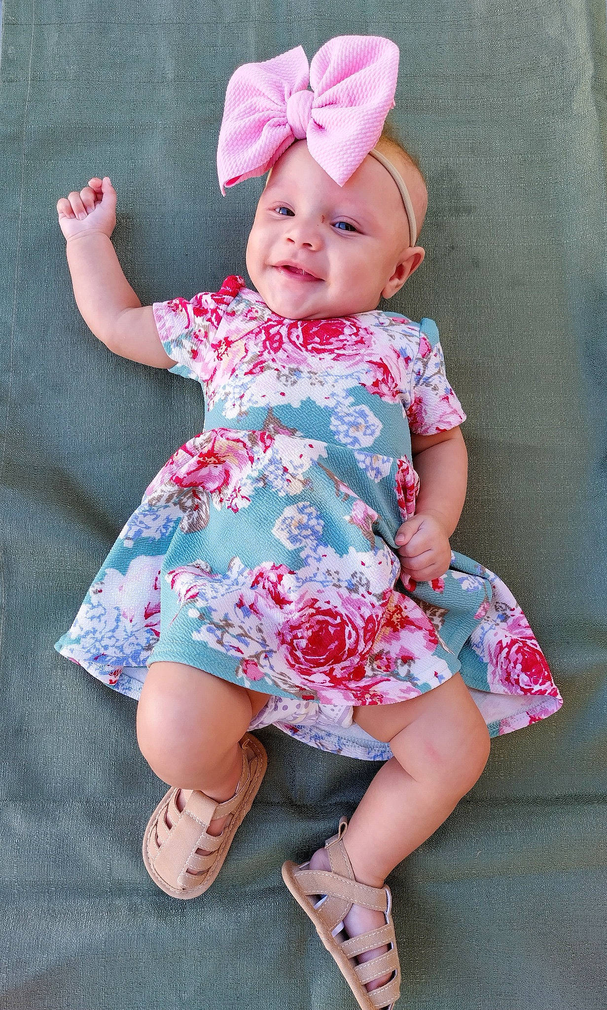 Kadriana is registered to the contest to win money with this photo: baby, baby_toddler_clothing, child, day_dress, dress, face, facial_expression, foot, happy, headwear, magenta, one_piece_garment, pattern, person, pink, purple, sandal, skin, sleeve, smile