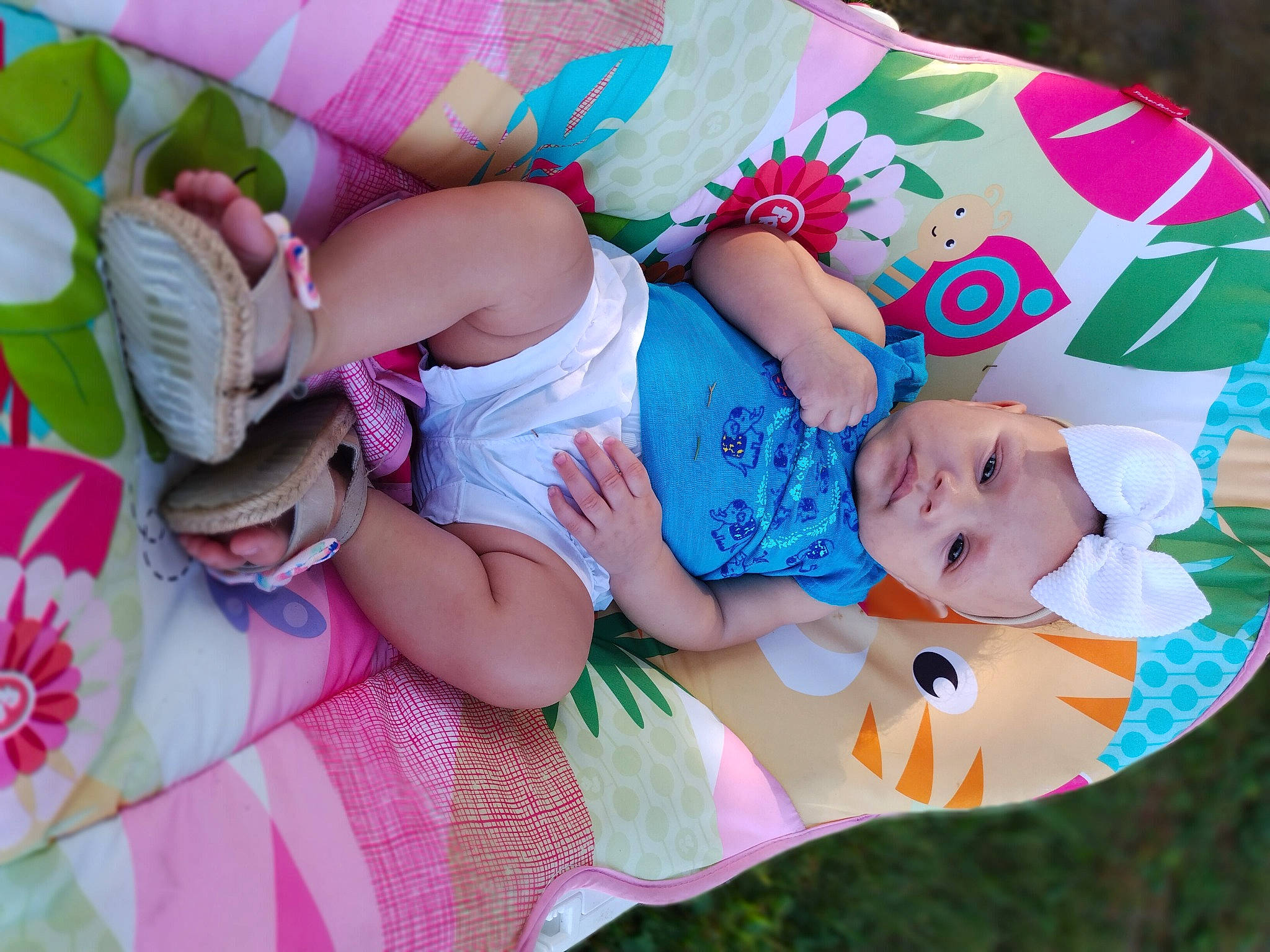 Kadriana is registered to the contest to win money with this photo: baby, baby_products, baby_toddler_clothing, child, comfort, eye, facial_expression, finger, fun, grass, happy, hat, human_body, pattern, person, pink, product, skin, textile, thigh