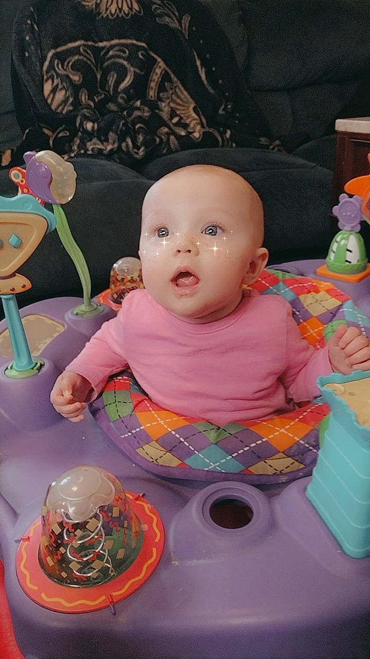 Vivianna is registered to the contest to win money with this photo: baby, baby_products, baby_toddler_clothing, baby_toys, cheek, child, event, fun, person, pink, plastic, play, purple, room, serveware, sitting, skin, surprise, table, tableware