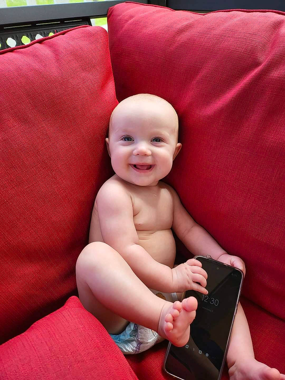 Vivianna joined the competition — help win amazing prizes! arm, baby, baby_toddler_clothing, cheek, chest, comfort, face, finger, happy, human_leg, joy, lap, magenta, nail, person, red, skin, smile, stomach, thigh